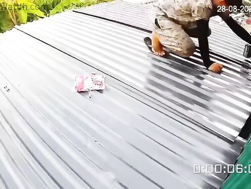 Man falls through roof while walking on it