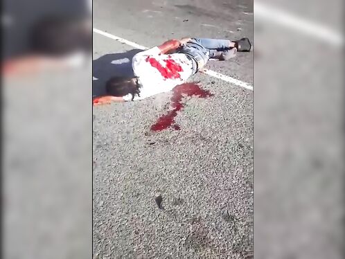 Man lies in street after a violent crash