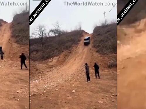 Car rolls down a dirt hill and crashes into a ravine