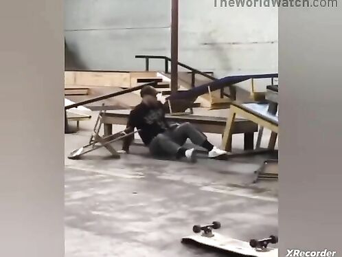 Woman slips on wet floor, sign warns of hazard