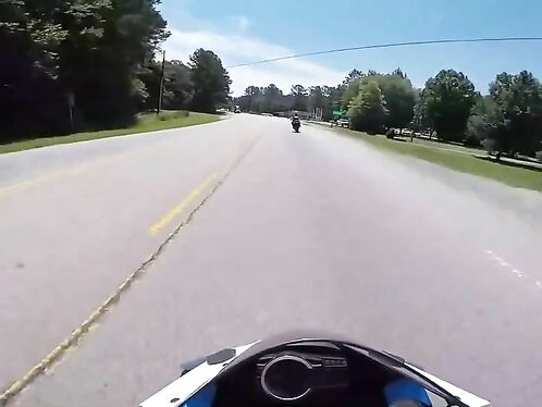 Biker lays down motorcycle to avoid collision