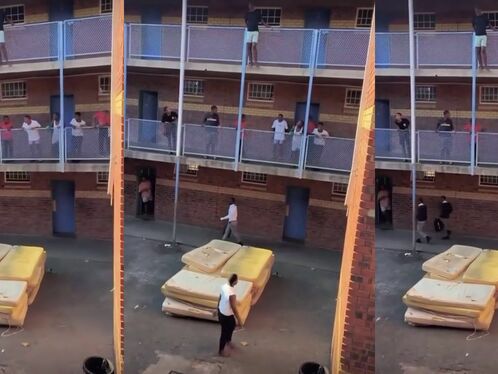 Man throws a mattress from a balcony