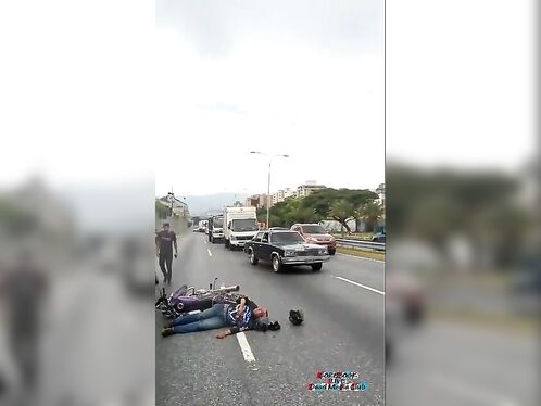 Motorcyclist lies injured on road after crash