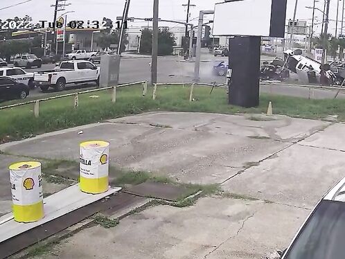Car hits barrels and flies through gas station