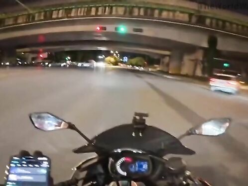 Motorcycle swerves to avoid cars in heavy traffic