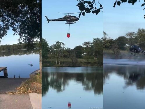 Helicopter skims over lake during daring operation