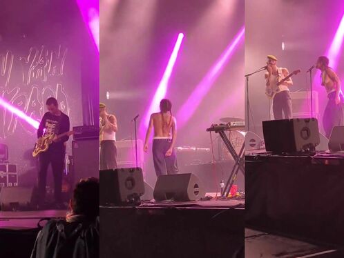 Singers perform bare-chested at a concert