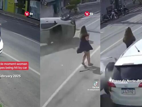 Car crashes into building after woman walks in front of it