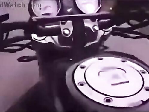 Motorcyclist dodges oncoming traffic on winding road
