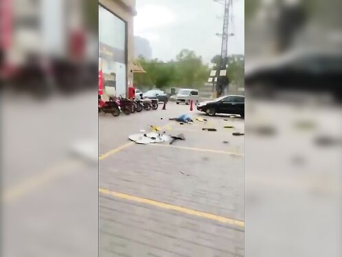 Storm debris falls on passerby
