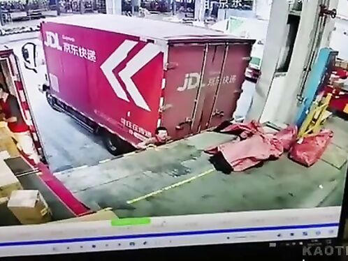 Workers struggle to lift heavy box off truck