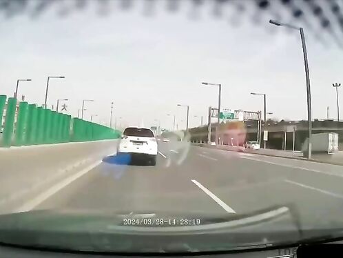 Man stands in middle of highway