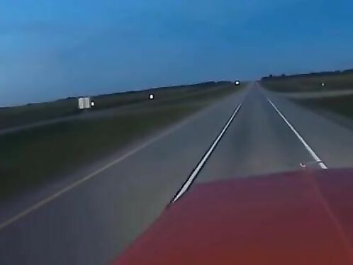 Driver records oncoming car suddenly swerving into lane