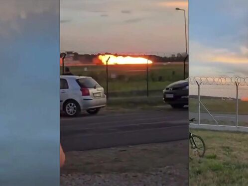 Man cheers as jet spews flames during takeoff