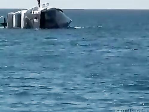 A person falls into the sea from a boat