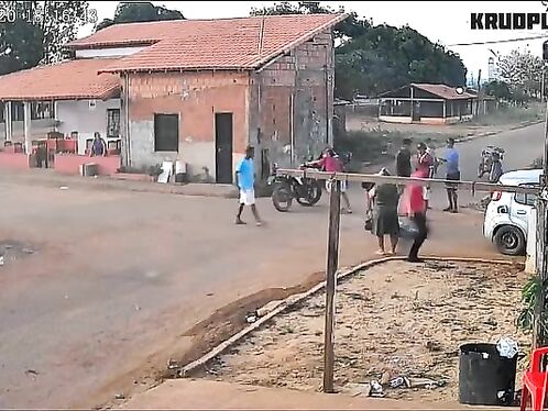 Cow attacks car in chaotic small town scene