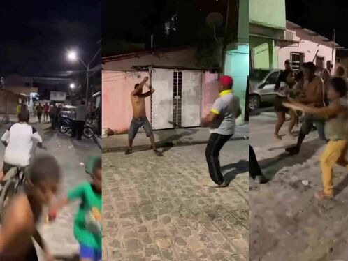 Group of men get into a brawl outside a building