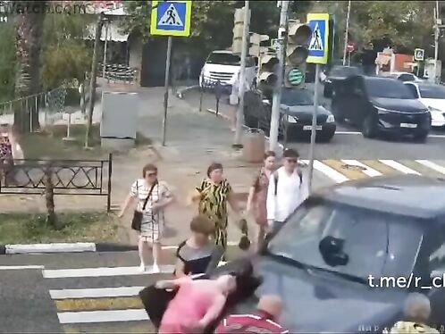 Group of people struggle with crosswalk chaos and near-miss