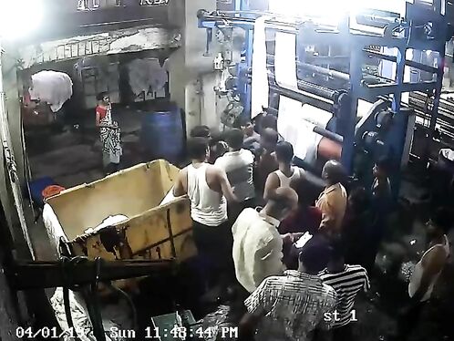 Workers tussle over laundromat laundry cart