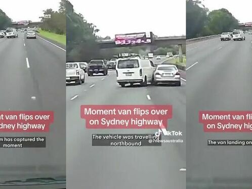 Van flips sideways on busy highway