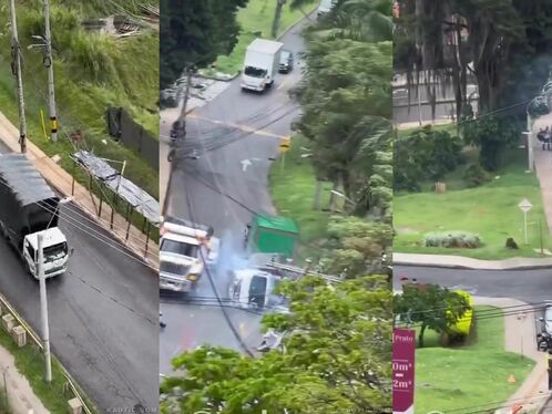 Man crosses busy street, narrowly avoiding traffic