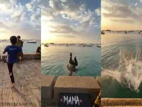 Boy jumps off pier with a dramatic belly flop