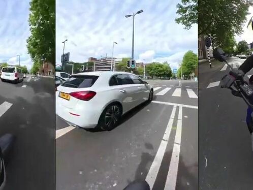 Car runs red light and nearly hits a motorcyclist