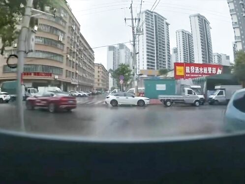 Truck speeds around roadblock and almost hits people
