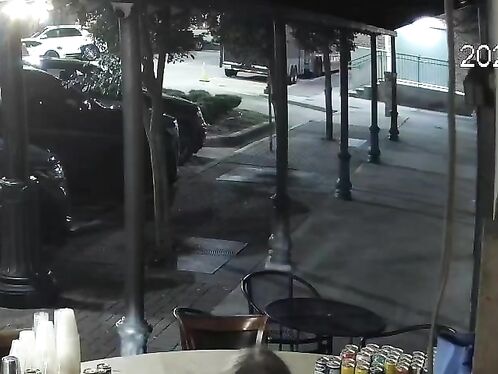 Man rides motorcycle through restaurant