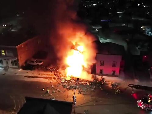 Firefighters battle massive house explosion flames