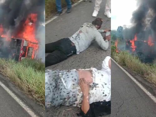 Bus burns intensely on the side of the road