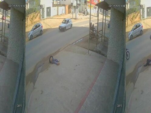 Man stumbles and falls at a bus stop