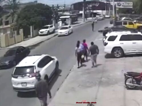 Man stops traffic by walking down the street waving his arms
