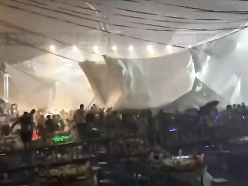 Crew scrambles to fix tent during outdoor concert
