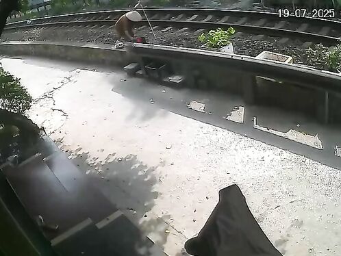 Elderly woman struggles to cross with groceries
