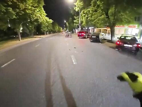 Motorcycle rider crashes in the middle of the street