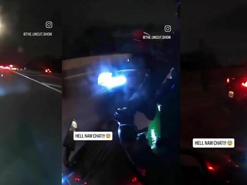 A man's hand in the road gets run over by a car