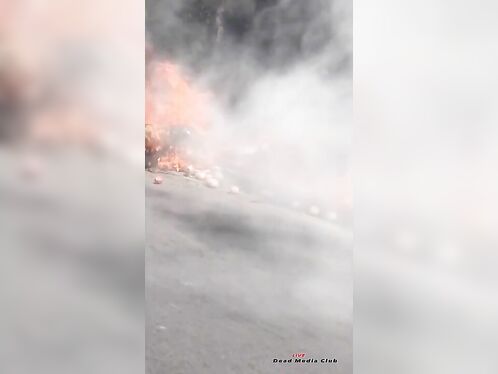 Motorcycle bursts into flames on highway shoulder