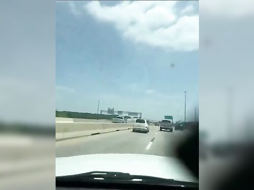 Van swerves wildly on highway near tornado