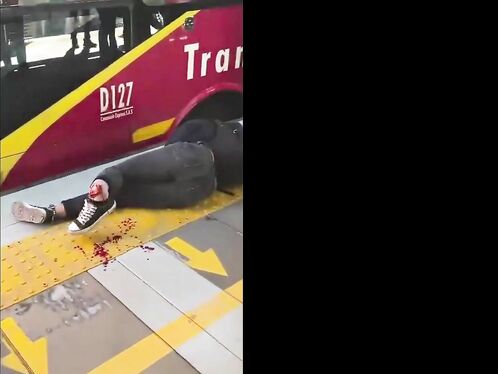 Man gets hit by bus and is left lying in the street