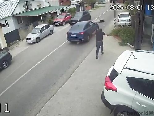 Man throws a shoe at a moving car on the street