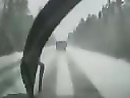 Truck crashes into oncoming car in dense fog