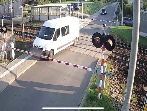 Van driver tries to beat train