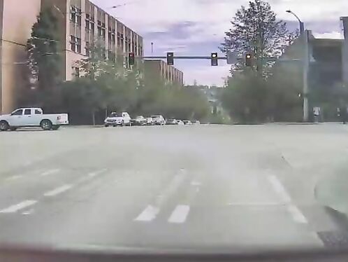 Car skids and spins out of control at intersection