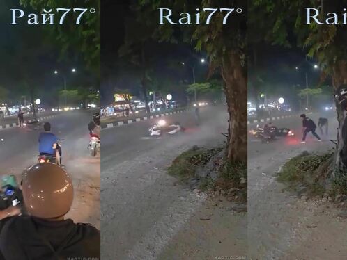 Man runs from crashed motorcycle in the street