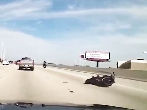 Motorcyclist falls off highway barrier while trying to get back on the road