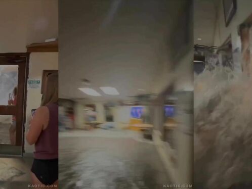 Woman runs through a hotel's flooded hallway