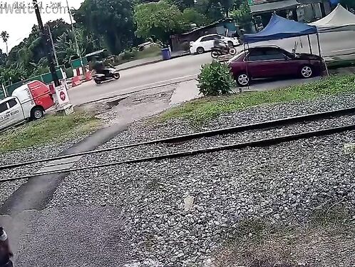Train almost hits a person crossing the tracks