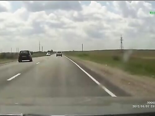 Car rolls off highway into grass during storm
